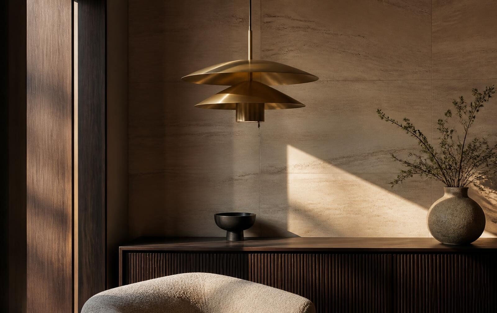 An Inara fixture read against a stone wall in daylight